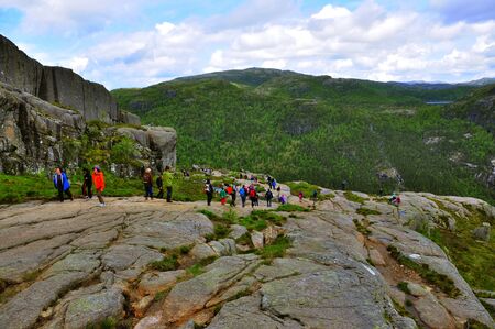 LYSEFJORD-NORWAY, 05JUNE-2017    tourists in preikestolen or pulpit in Norway on a day with cloudsclimb to the prektestolen or pulpit in Norwayclimb to the prektestolen or pulpit in Norwayのeditorial素材