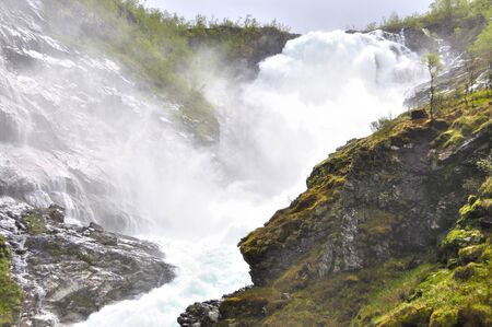 The Kjosfossen waterfall seen from the famous flam train in Norwayの写真素材