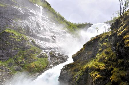 The Kjosfossen waterfall seen from the famous flam train in Norwayの写真素材