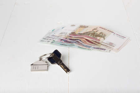 Russian paper money house keys on the tableの写真素材