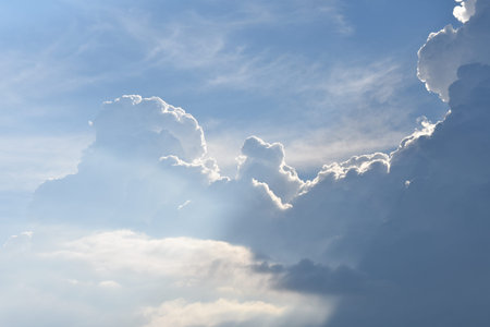 Summer clouds backlit by the sun