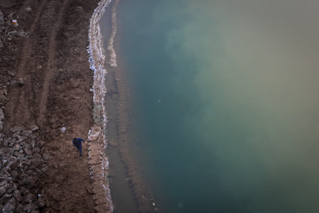 man walking on the water side