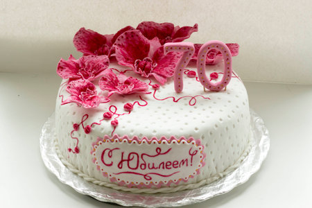 sweet pink orchids white anniversary cake closeupの写真素材