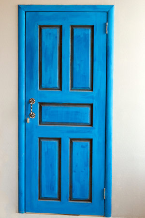 front entrance of a home with a blue door