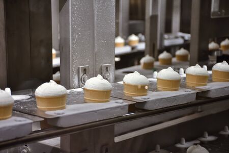 waffle cup ice cream on factory conveyor, ice cream on a conveyor beltの写真素材