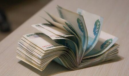 twisted wad of money, banknote packingの写真素材