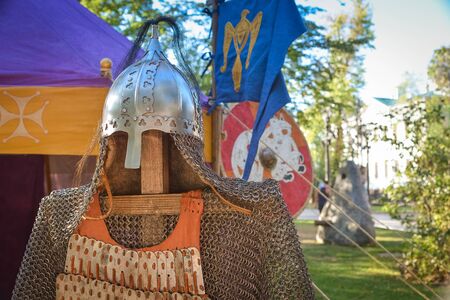 metal mail and warriorâs helmet on a close-up standの写真素材