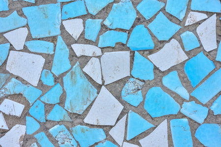 texture of pieces of blue ceramic tiles. Blue broken ceramic tile mosaic background. Broken tiles...