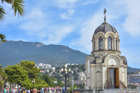 Yalta, Ukraine - September 13, 2020: Embankment in the resort town of Yalta, People walk along the...