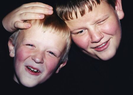 Casual portrait of two brothers acting up.の写真素材