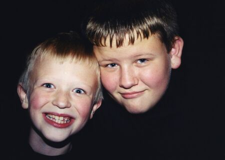 Portrait of two boys with different personalities.の写真素材