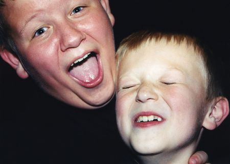 Casual portrait of two brothers acting silly.の写真素材