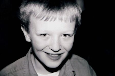 Black and white smiling portrait of preteen boy.の写真素材