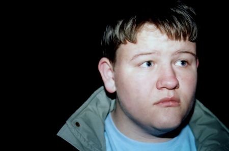 Portrait of teenage boy looking away.の写真素材