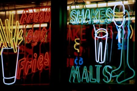 Neon lights in window of a restaurant.の写真素材