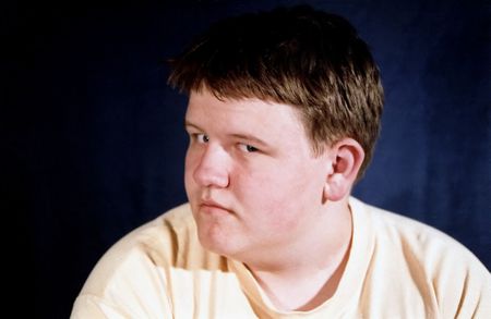 Teenage in profile with suspicious expression.の写真素材