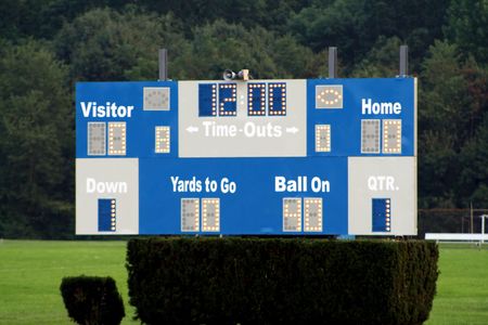 Scoreboard at a high school football game.の写真素材