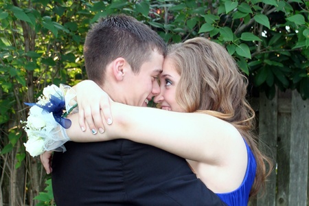 Prom Couple Sharing An Eskimo Kissの写真素材