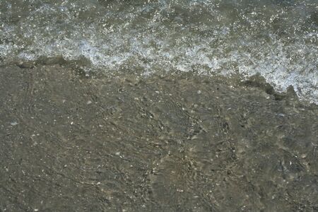 Undertow of moving ocean water in closeup.の写真素材