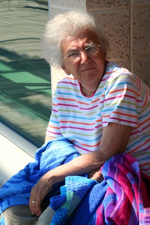 Windy Senior Woman on Boardwalkの写真素材