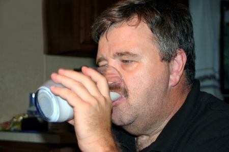 Middle-Aged Man Drinking Milkの写真素材