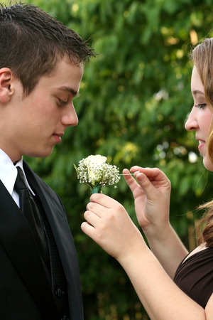 Prom Couple Preparing Boutonniereの写真素材