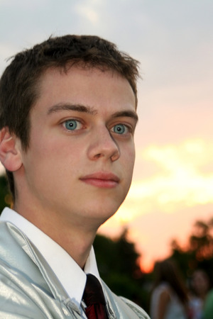 Serious Male High School Graduate In Sunsetの写真素材