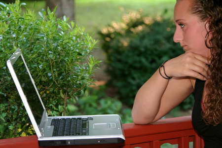 Closeup Teen Girl Studying Laptop Outdoorsの写真素材