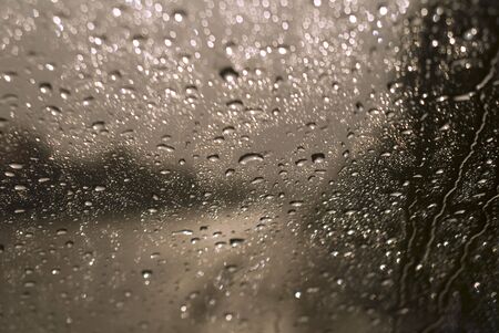 rain drops on the glass in overcast dayの写真素材