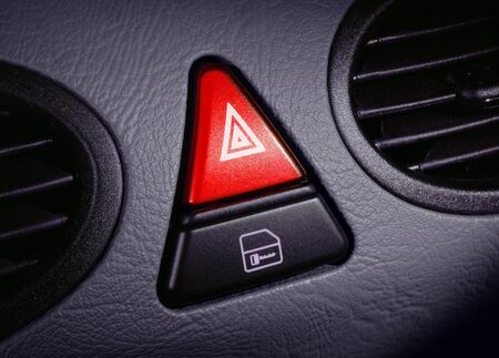 red emergency button on a dashboard of carの写真素材