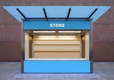 empty news stall on street of city at night timeの写真素材