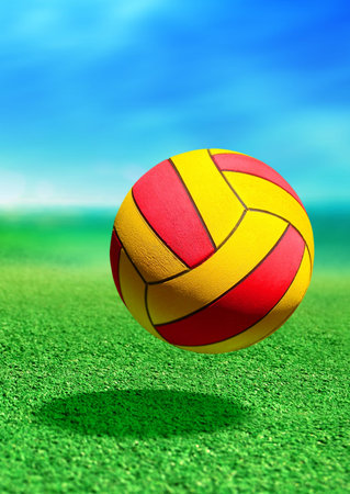 multicolored ball on green ground in motionの写真素材