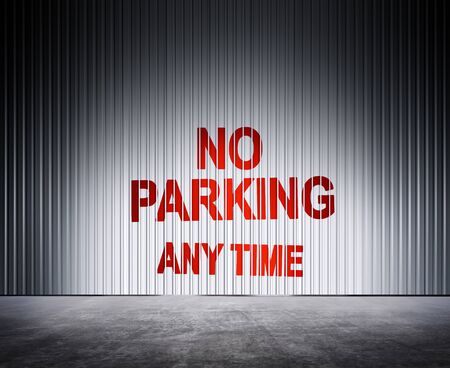 red inscription on metal fence which notifies about ban of parkingの写真素材