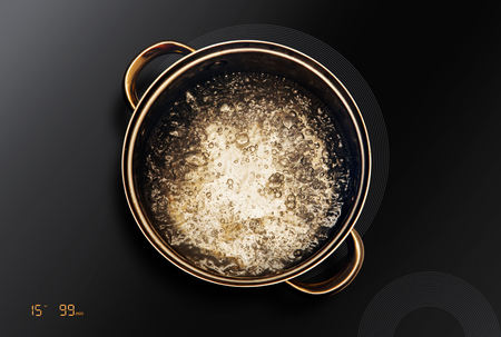 boiling water in saucepan that on an induction cooktopの写真素材