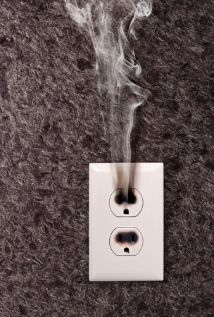 smoke from the outlet which has burned downの写真素材