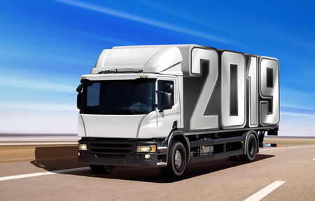 White truck like incoming year 2019 moving on roadの写真素材