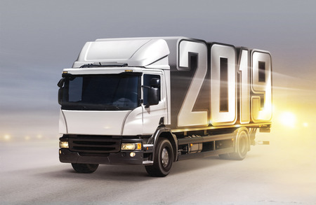 white truck with 2019 on ice road in blizzardの写真素材