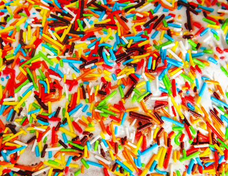 multi-colored sprinkles on rich bread for an easter holidayの写真素材