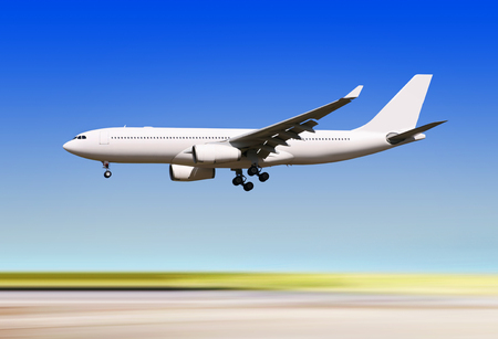 big passenger airplane is landing to runway of airportの写真素材