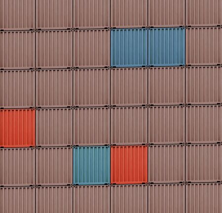 background of multi-colored freight shipping containers in a dockの写真素材