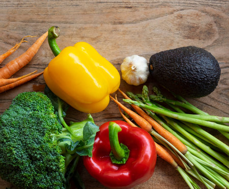 Flat lay of fresh vegetables on wooden table background,Concept of healthy living