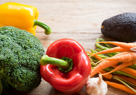 Flat lay of fresh vegetables on wooden table background,Concept of healthy living