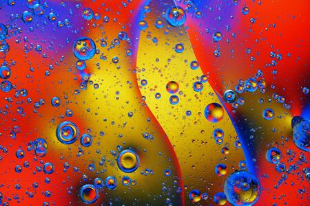 Abstract background of colorful bubbles on the surface of water and oil for your design.の写真素材