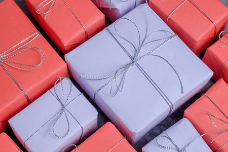 Lots of new year presents wrapped in red and lilac paperの写真素材
