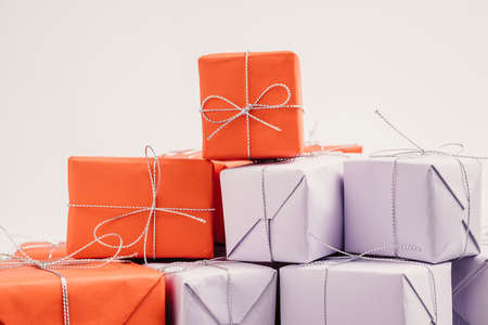 Lots of gifts wrapped in red and lilac paper and tied with silveの写真素材