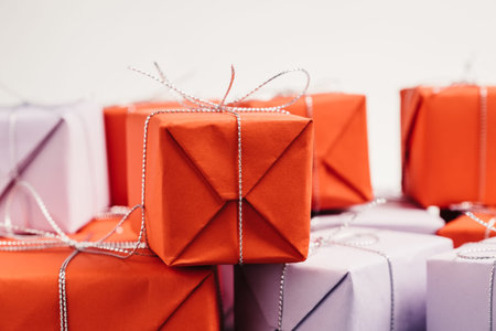 Gift wrapped in red paper and tied with silver twine