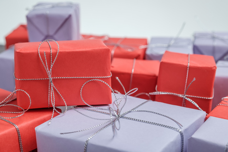 Few gifts wrapped in red and lilac paperの写真素材