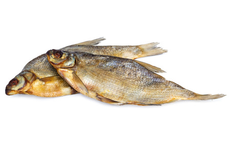 two dried salted fish isolated on white backdrop. Traditional russian food processing to preserve nutritional propertiesの写真素材
