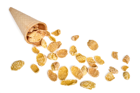 Corn flakes scattered from ice cream waffle cone isolated on white backgroundの写真素材