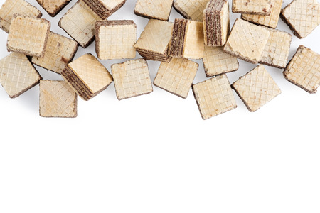 heap square wafer biscuits isolated on white background. Top view, copy space for textの写真素材